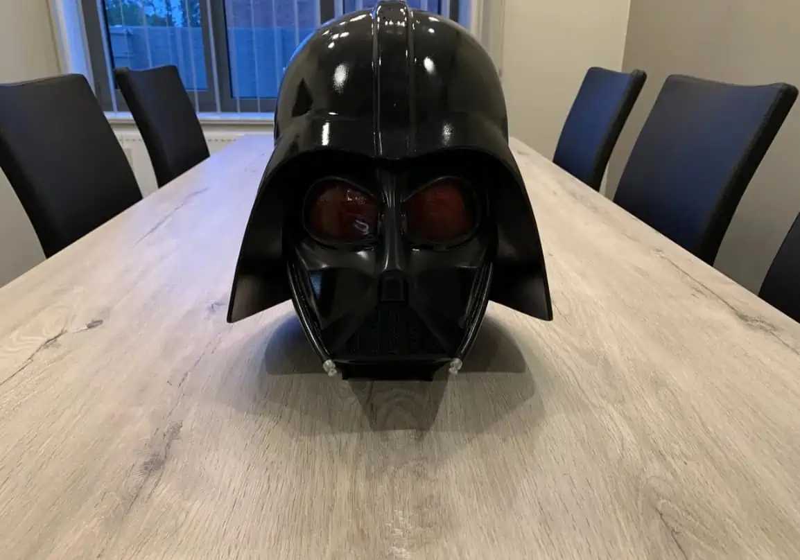 darth vader helmet on a table